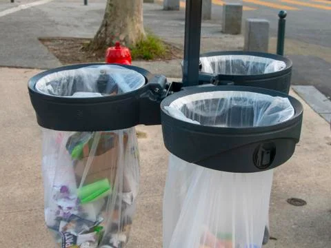 City bins with different types of garbage Stock Photos