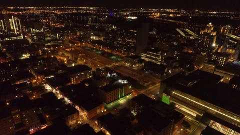 City blocks seen in an overhead point of view by a drone flying at night Stock Footage 121540059