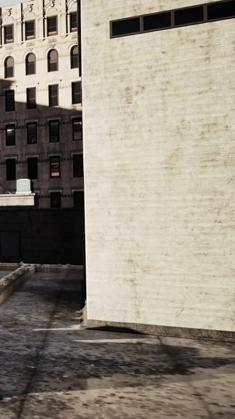 City building and wall with sunlight in urban area during the day Stock Footage 342190219
