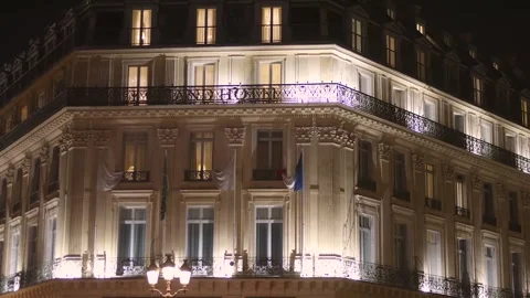 City building with glowing warm light in the evening, Paris, France. Stock Footage 337480800