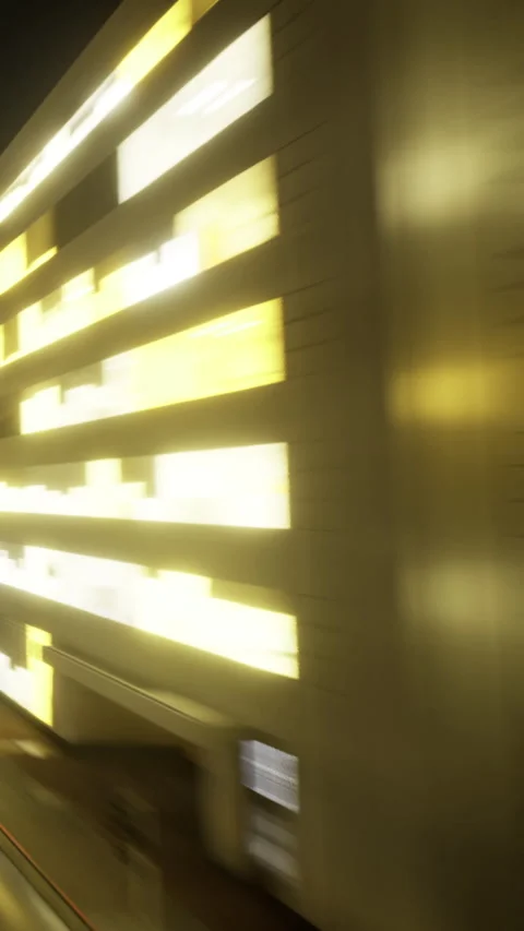City building lights create bright patterns at night along the street Stock Footage 336998211