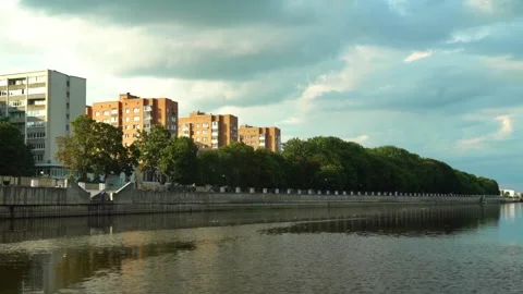 City buildings along the river with cloudy sky during late afternoon Stock Footage 340448049
