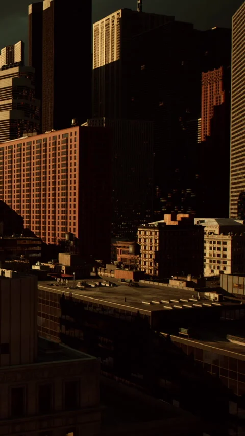 City buildings create a skyline with dark clouds overhead in the late afternoon Stock Footage 337929009