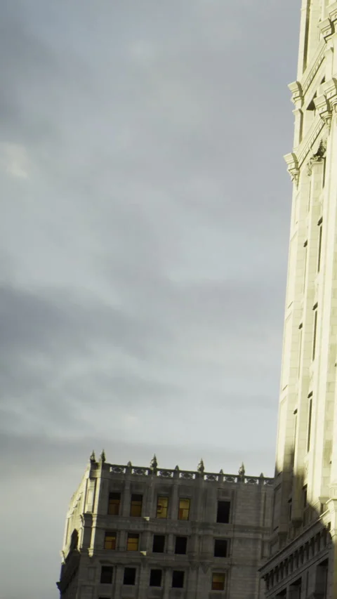 City buildings under cloudy sky during late afternoon light Stock Footage 334247801