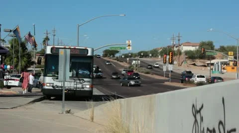 City Bus Departs Traffic at Intersection Stock Footage 12202809