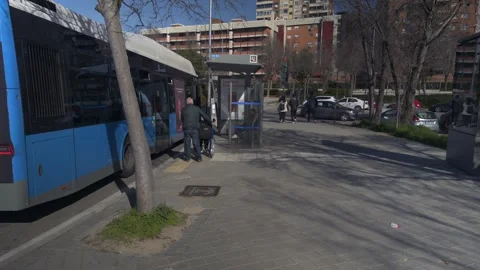 City bus deploying access ramp at bus stop, public transport accessibility Video stock 329510062