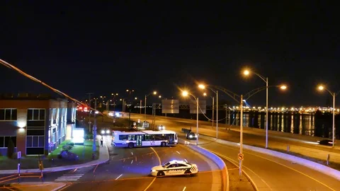 City bus doing a U-turn in the middle of the road Stock Footage 95735272