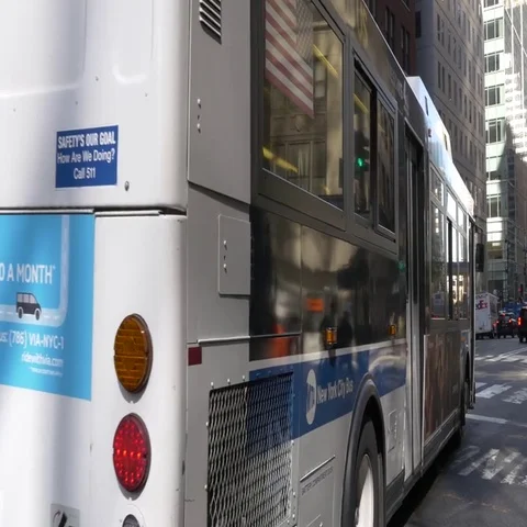 City bus pulls away public transportation Stock Footage 69540356