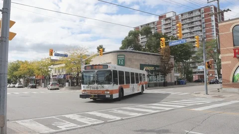 City bus turning at intersection Stock Footage 117208814