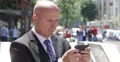 City Center Businessman Checking E-Mail Box Using Smartphone Mobile Connection 4k or 4k+ Resolution