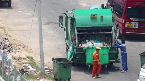 City cleaning, garbage collection by garbage truck Stock Footage 310179136