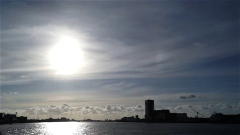 City clouds ship river sky sun bridge Stock Footage 73602290