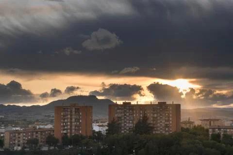 City cloudy sunset Stock Photos