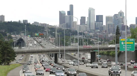 City commuter traffic freeway cars driving skyline time-lapse Stock Footage