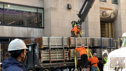 City Construction workers put up equipment for Rockefeller Center Christmas Tree Stock Footage 143482853