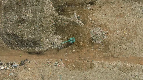 City dump, People are sorting garbage at the job site, aerial view. Stock Footage 107867686