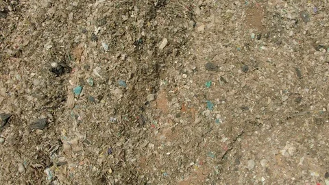 City dump, People are sorting garbage at the job site, aerial view. Stock Footage 107867722
