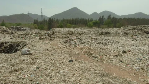 City dump, People are sorting garbage at the job site, aerial view. Stock Footage 107867790