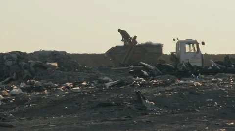 City dump.man preparing the machine for loading debris. Stock Footage 68861481