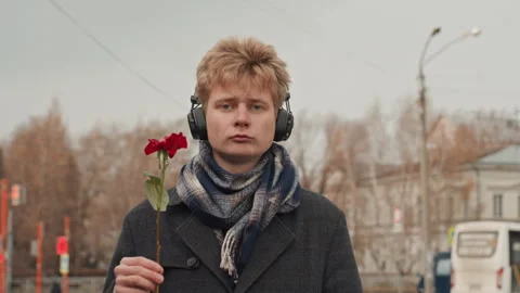 City environment features defiant individual wearing headphones. Silent Stock Footage 335173593