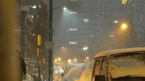City in the evening snowing Stock Footage 86455068