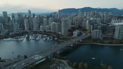 City Evening Traffic Aerial Pull from Downtown Bridge in Vancouver BC 4k Stock Footage 327532206