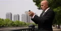 City Financial Center American Businessman Use Mobile Phone Send E-Mail Messages 4k or 4k+ Resolution
