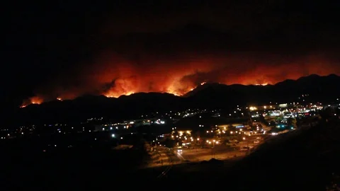 A city with a fire behind it Stock Footage 109204595