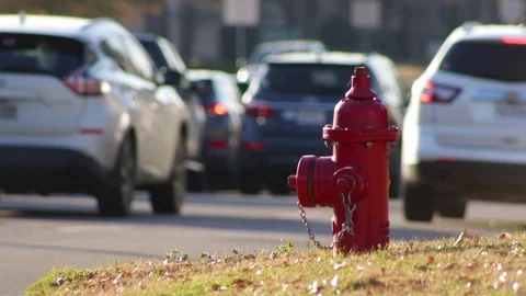 City Fire Hydrant With Rush Hour Traffic At Sunset Video stock 99427288