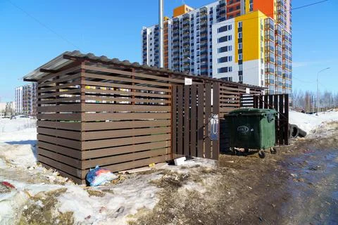 City garbage dump with garbage cans is wide open and garbage is around it Foto stock