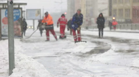 City hall service cleaning up falling snow Stock Footage 59654360