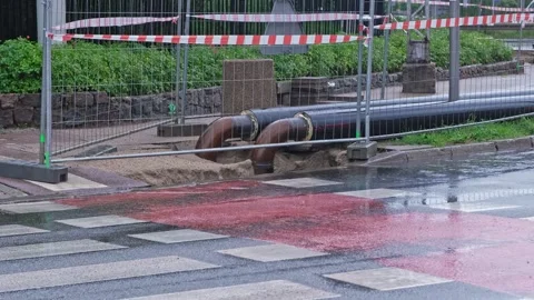 City Heating Distribution System Pipes Mainenance Work Suspended due to Rain Stock Footage 317329710