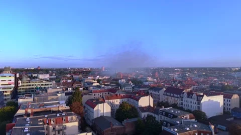 City infrastructure arson attack with smoke plume. Amazing aerial view drone 動画素材 345230449