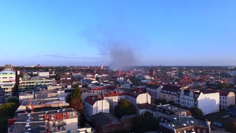 City infrastructure arson attack with smoke plume. Perfect aerial view drone 動画素材 345230565