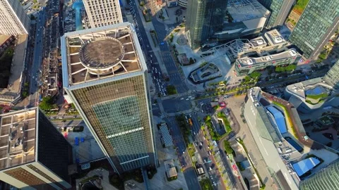 City intersection below a rooftop landing pad in Guangzhou China Video stock 345955530