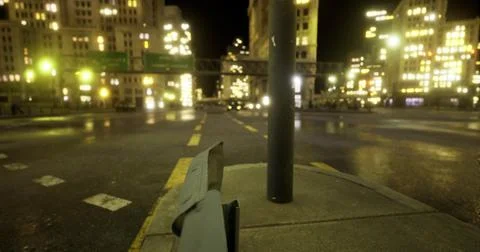 City intersection at night with bright lights and urban atmosphere Stock Illustration