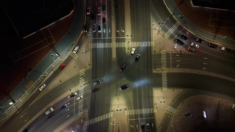 City Intersection Time Lapse Nighttime Drone Video Stock Footage 310862975