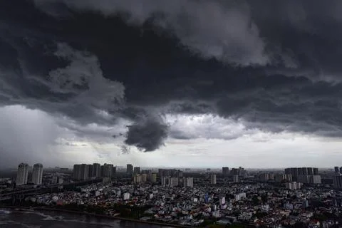 A city with a large cloud in the sky Stock Photos