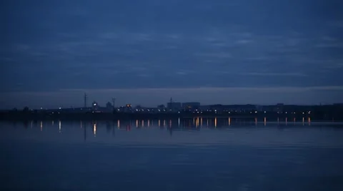 City lights reflected in water in the evening Stock Footage 68314894