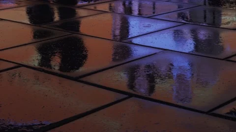 City lights reflected in wet pavement Stock Footage 146926375