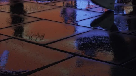 City lights reflected in wet pavement Video stock 146926401