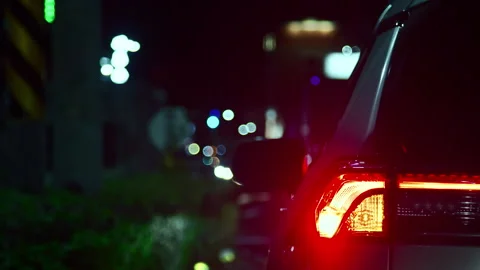 City Lights: SUV Taillight Blinking with Urban Bokeh Background - Taiwan Vídeos de archivo 311745936