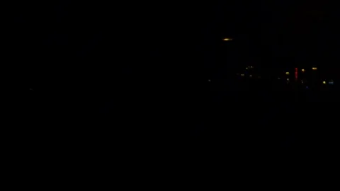 City lights through the window of train traveling at dark night. Stock Footage 120651917