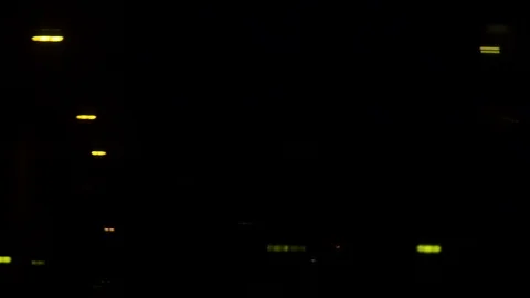 City lights through the window of train traveling slow at dark night. Stock Footage 120652142