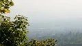 City lying at foot of mountain in thick haze, peaceful landscape, panorama view HD Footage
