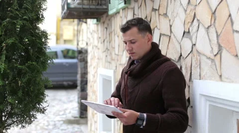 In the City Man Uses Tablet Stock Footage 65017816