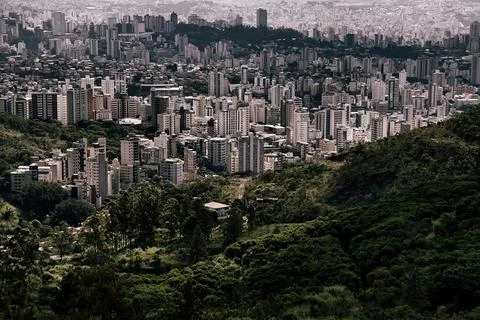 A city with a mountain in the background Stock Photos