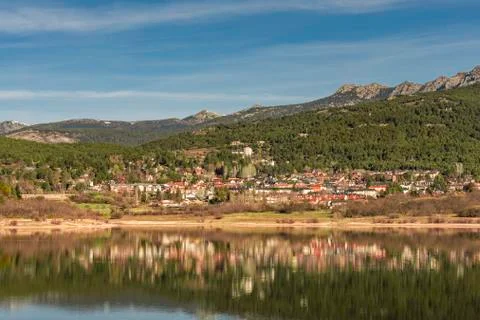 The city of navacerrada reflected in its pond. Spain Madrid Guadarrama. Stock Photos