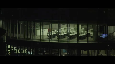 City night time offices with empty desks lined up Stock Footage 57640237