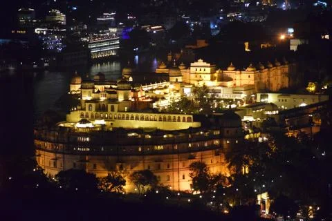 City palace night view from Shri Manshapurna Karni Mata temple for city - Uda Stock Photos